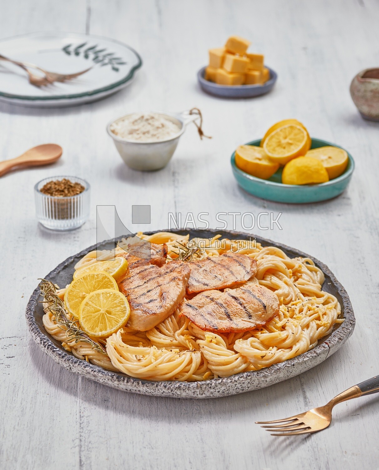 Plate of spaghetti  with chicken and appetizers