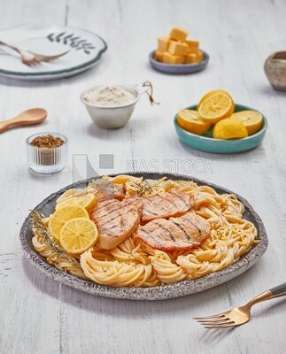 Plate of spaghetti  with chicken and appetizers