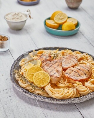 Dining table With a plate of spaghetti  with chicken