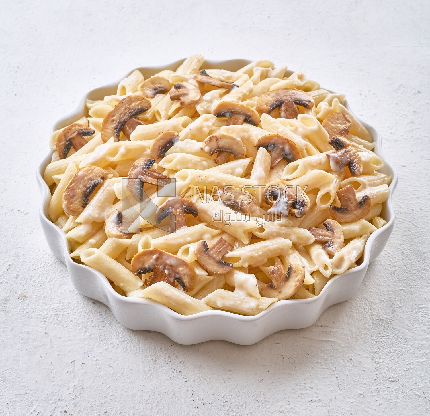 Pasta with mushrooms on a solid background