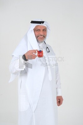 old Saudi man wearing a white dress, drinking a cup of tea, self-confidence, white background, Saudi model
