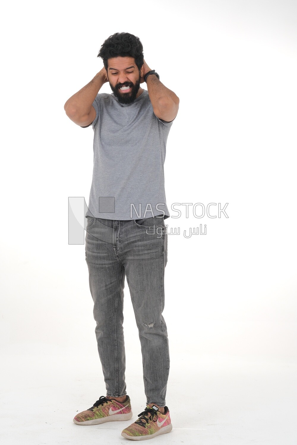 Saudi man wearing a casual dress with his hands on his head, feeling pain and headache, wearing a white dress with a shemagh and headband, white background