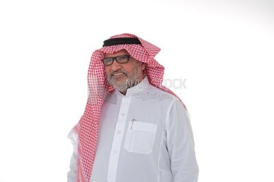 close-up of a Saudi man in traditional Saudi dress, wearing glasses, Saudi model, white background