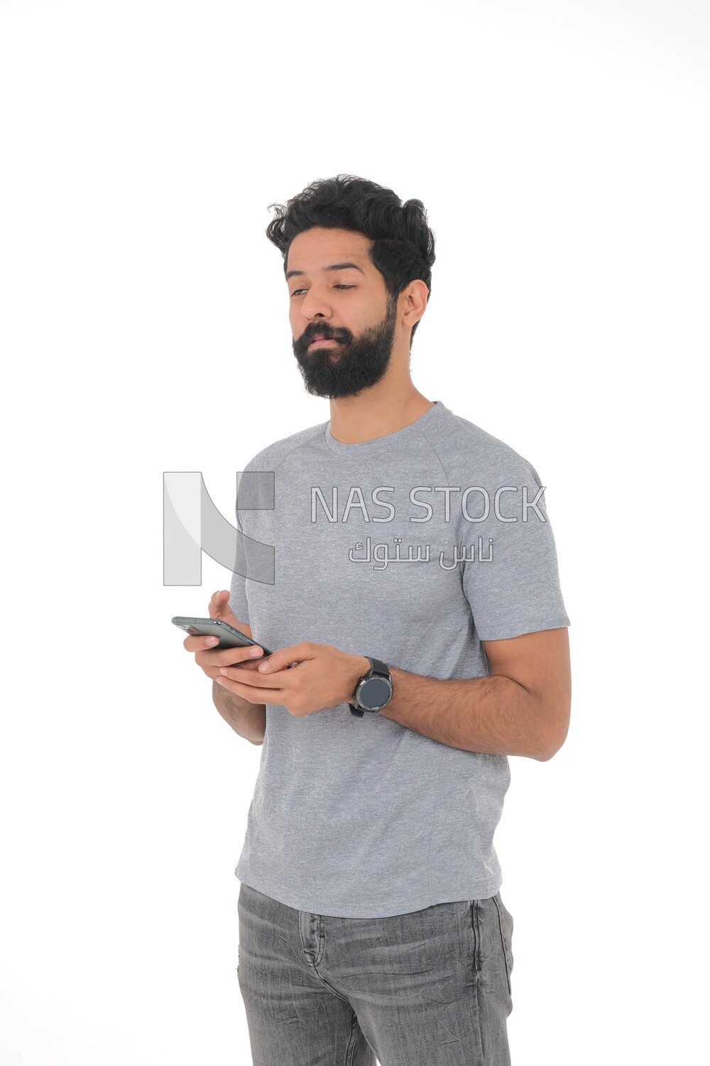 close-up of a Saudi man looking angry, wearing casual clothes, carrying his mobile phone, Saudi model, white background