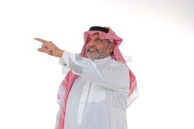 close-up of a Saudi man in traditional Saudi dress pointing away, side view, Saudi model, white background