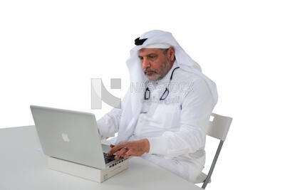 old Saudi man sitting in front of a laptop, business feasibility study,Saudi model, work