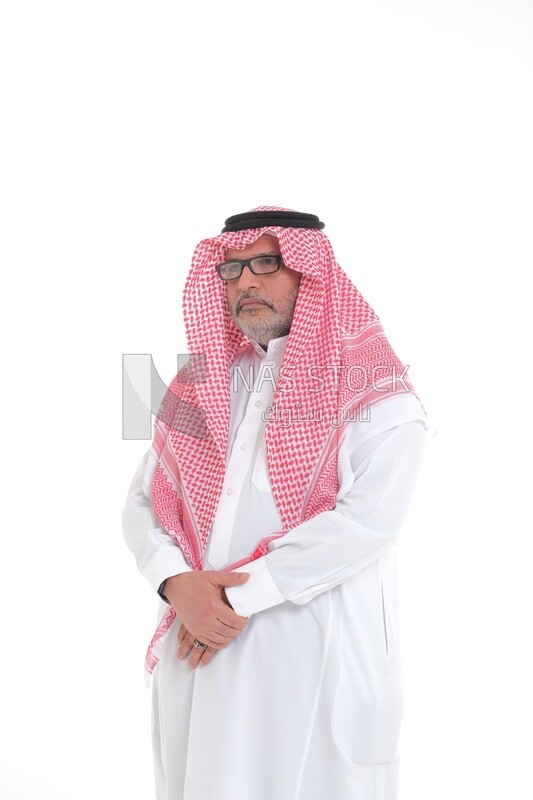 side view of a close-up of a Saudi man in traditional Saudi dress, wearing glasses looking away, Saudi model, white background