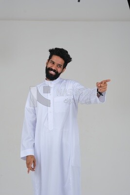 close-up of a Saudi man in traditional Saudi dress pointing away, side view, Saudi model, white background