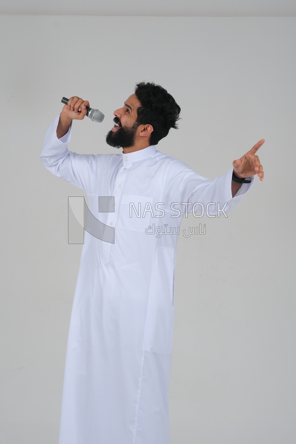 Saudi man in traditional dress holding the microphone, performing theatrical performances, giving speeches, dialogues and discussions, representative performance, lyrical theatrical art, white backgro