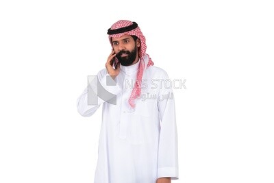 Saudi man using a mobile phone, talking on the phone , communicating with individuals, online requests and marketing, social relations, using technical devices, white background