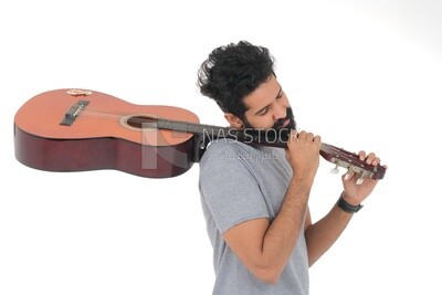 Saudi  man carrying a musical instrument, guitar playing talent, entertainment and singing, white background, Saudi model