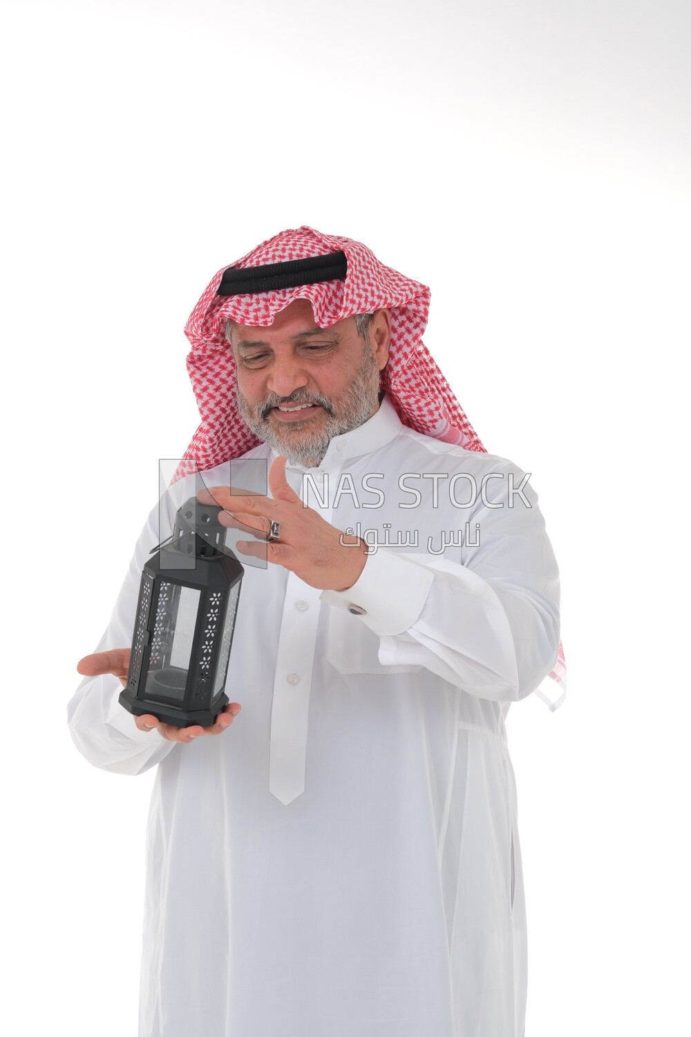 Saudi man holding a Ramadan lantern, Ramadan lantern, the blessed month of Ramadan, lighting and decorations for the month of Ramadan, Ramadan atmosphere, religious occasions