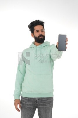 saudi man using a mobile phone, communicating with individuals, online requests and marketing, social relations, using technical devices, white background