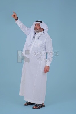 close-up of a Saudi man in traditional Saudi dress pointing away, side view, Saudi model
