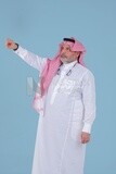 Saudi man using a mobile phone pointing on it, communicating with individuals, online requests and marketing, social relations, using technical devices