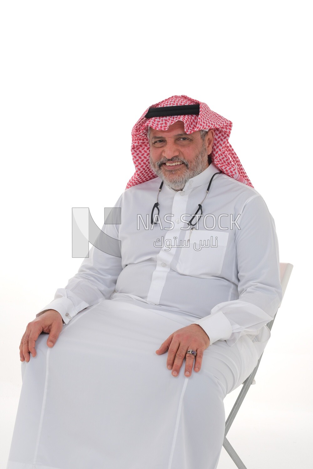 elderly Saudi man trying to sit on a chair, back and spine pain, fatigue and exhaustion, muscle spasms, health problems, white background, Saudi model
