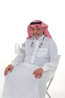 elderly Saudi man trying to sit on a chair, back and spine pain, fatigue and exhaustion, muscle spasms, health problems, white background, Saudi model