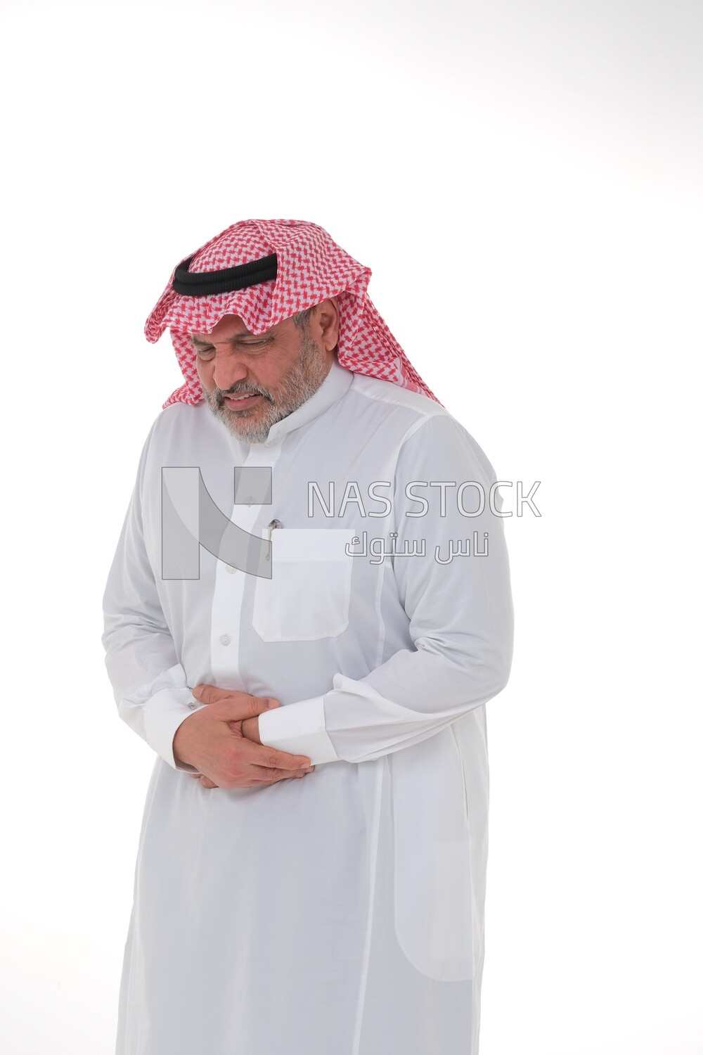 Saudi man placing his hands on his stomach,  abdominal and stomach pain, intestinal disorders, digestive system imbalance, white background