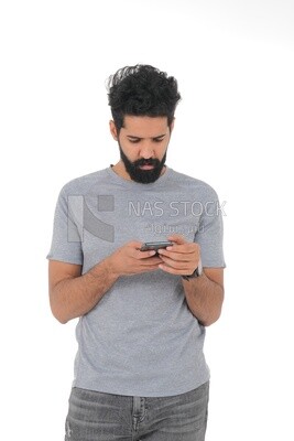 saudi man using a mobile phone, communicating with individuals, online requests and marketing, social relations, using technical devices, white background