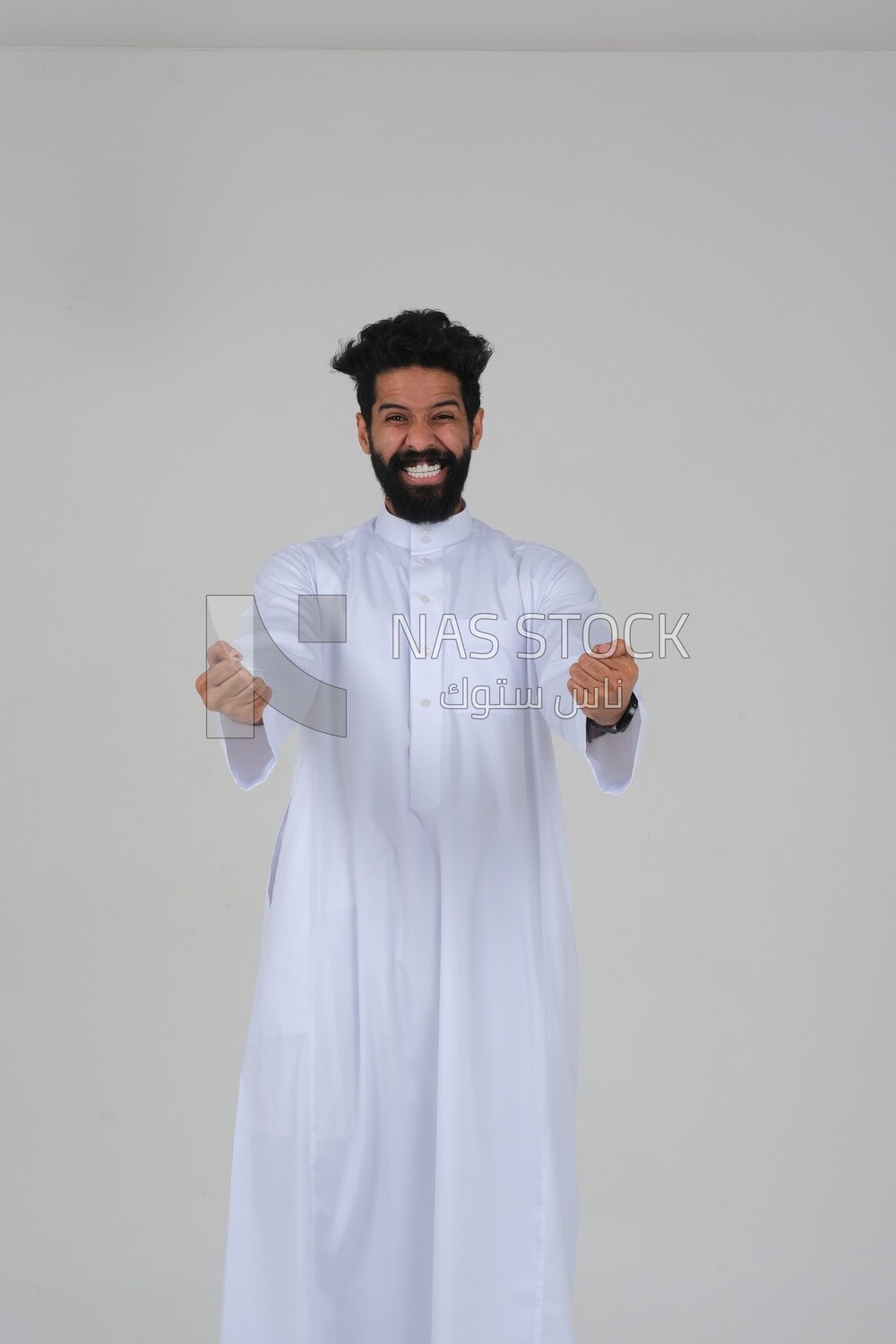 Saudi man wearing a white dress looks happy, facial gestures indicating happiness and joy, self-confidence, white background, Saudi model