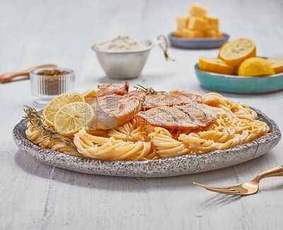 Side view of a plate of spaghetti with chicken