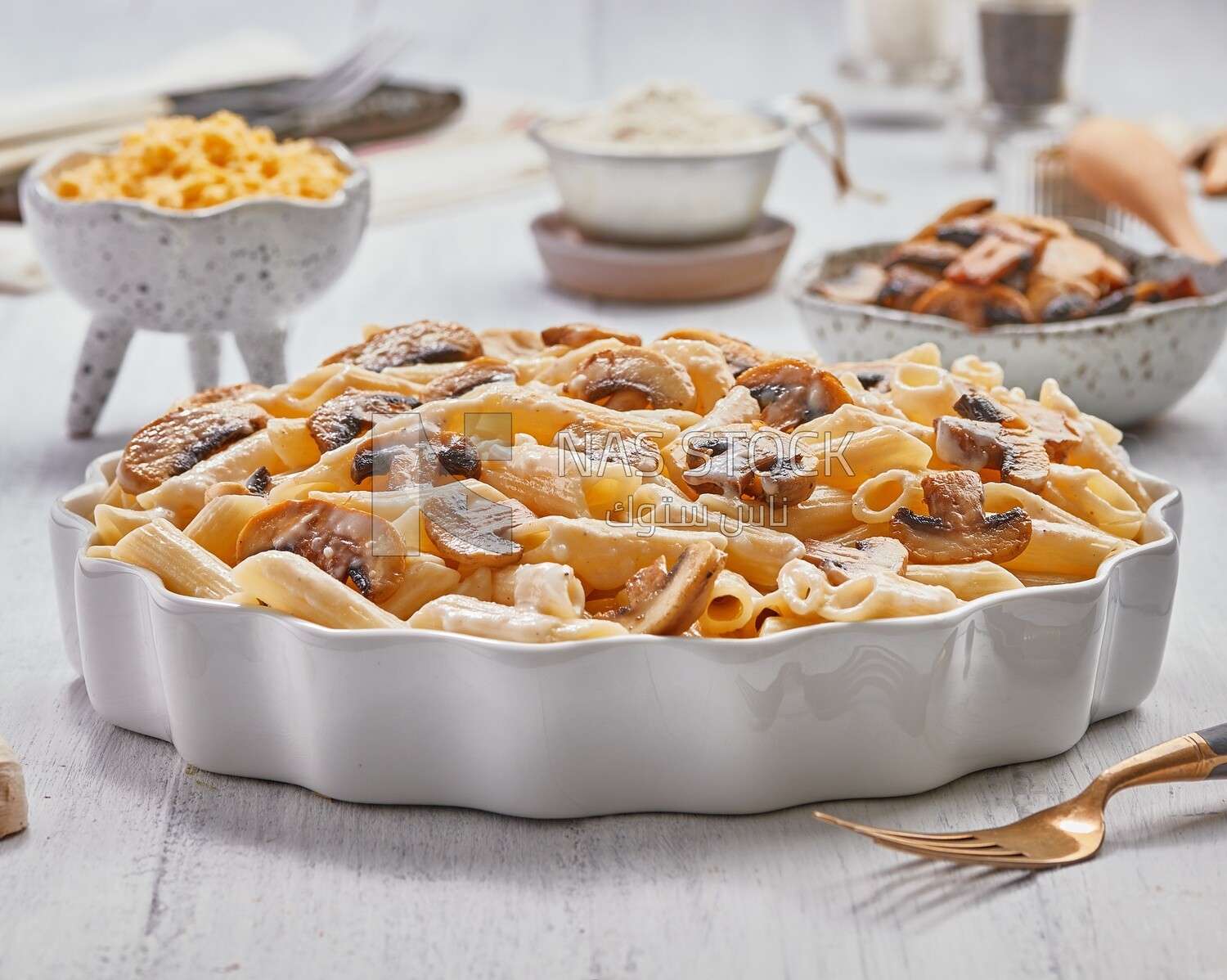 Side view of a plate of pasta with mushrooms