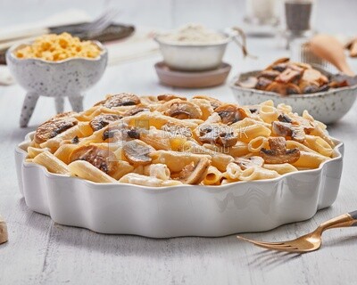 Side view of a plate of pasta with mushrooms