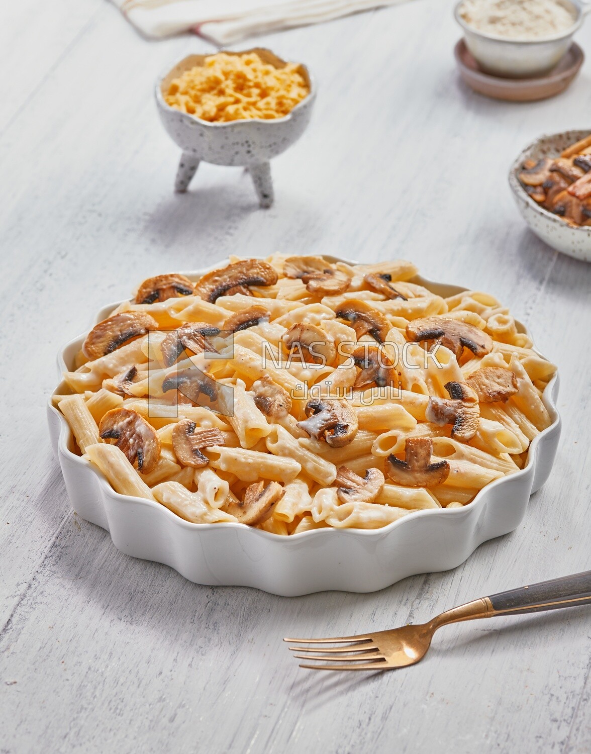 Top view of a plate of pasta with mushrooms