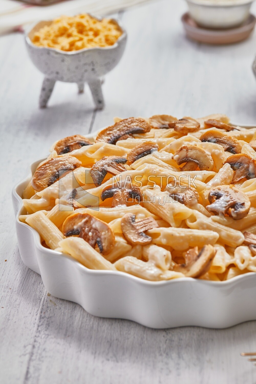 Side view of a plate of pasta with mushrooms