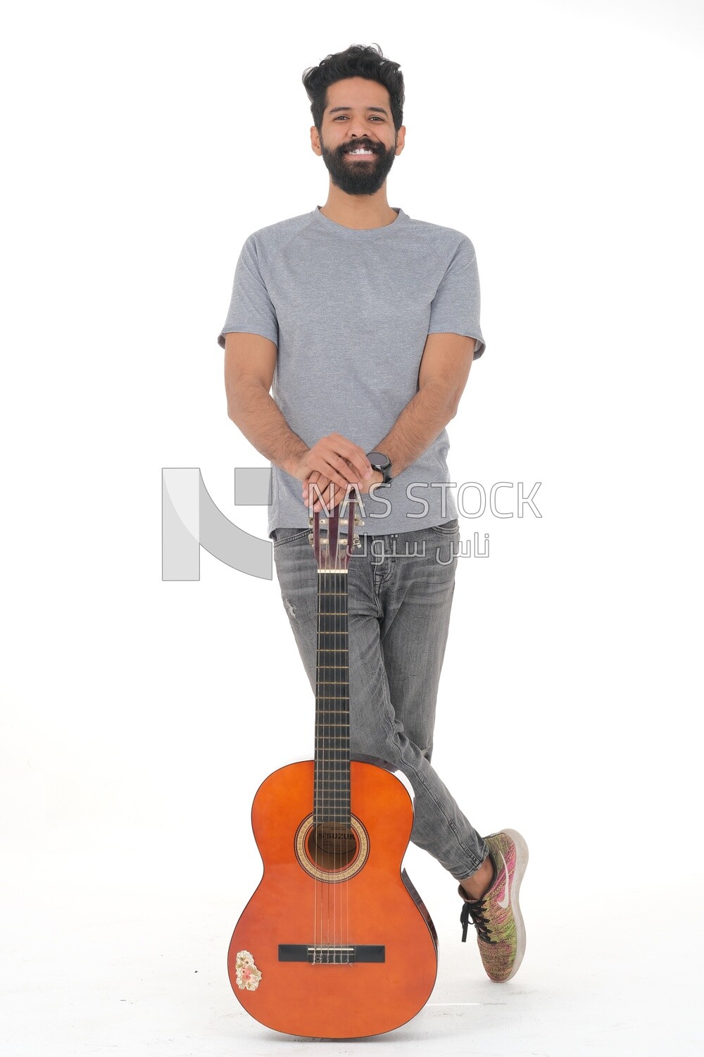 Saudi  man carrying a musical instrument, guitar playing talent, entertainment and singing, white background, Saudi model