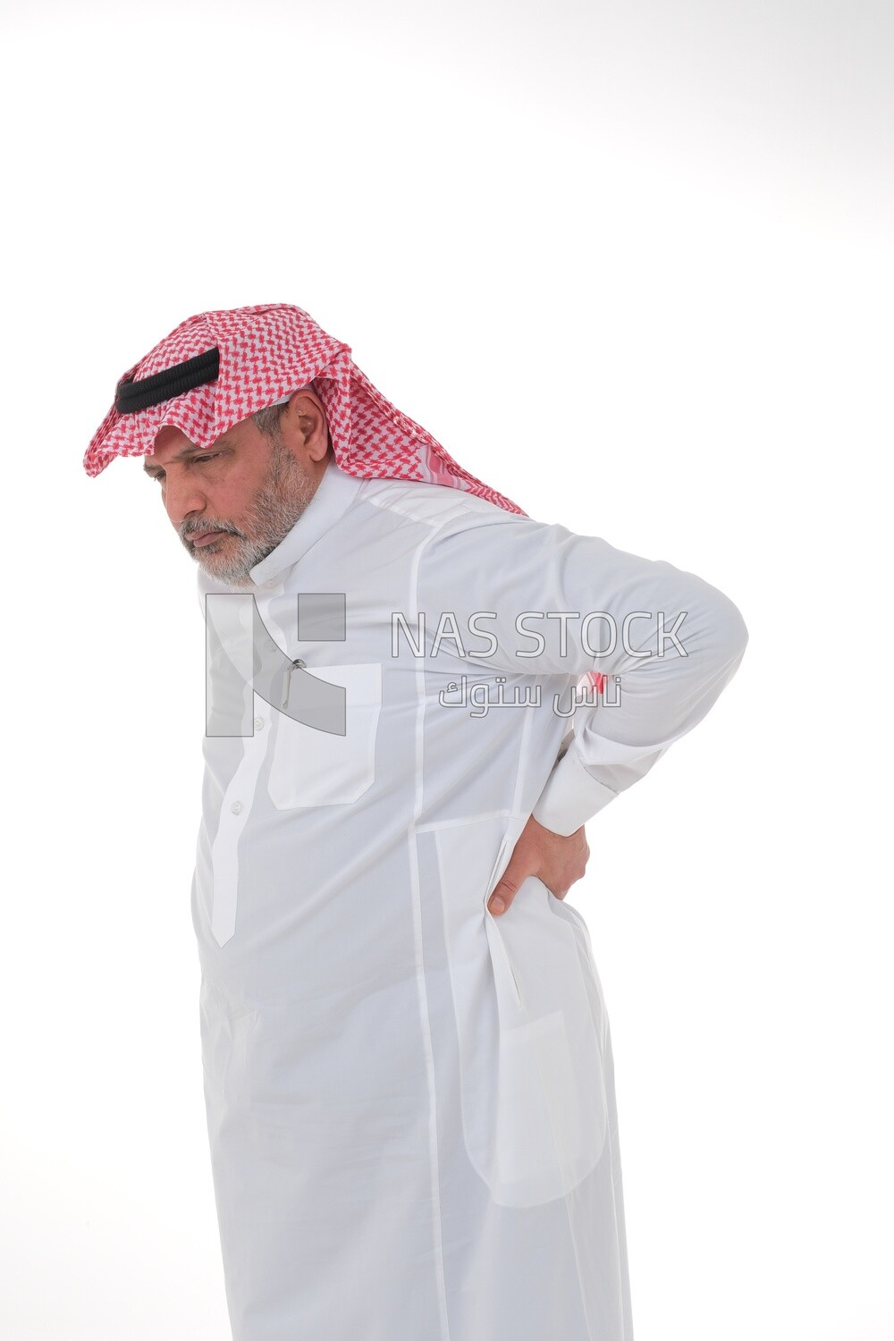 elderly Saudi man trying to sit on a chair, back and spine pain, fatigue and exhaustion, muscle spasms, health problems, white background, Saudi model