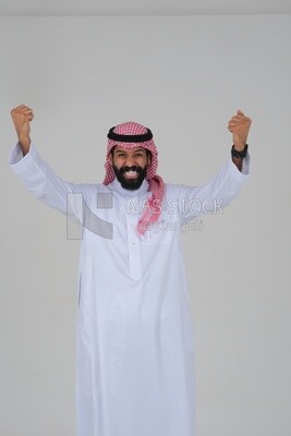 Saudi man wearing a white dress looks happy, facial gestures indicating happiness and joy, self-confidence, white background, Saudi model