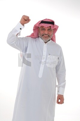 Saudi man raising his fist while smiling with different facial and hand gestures, a young Saudi man wearing a white dress with a shemagh and headband, white background