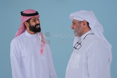 two Saudi men standing opposite each other talking together, meeting an acquaintance, confrontation and competition, standing with confidence and integrity, Saudi model