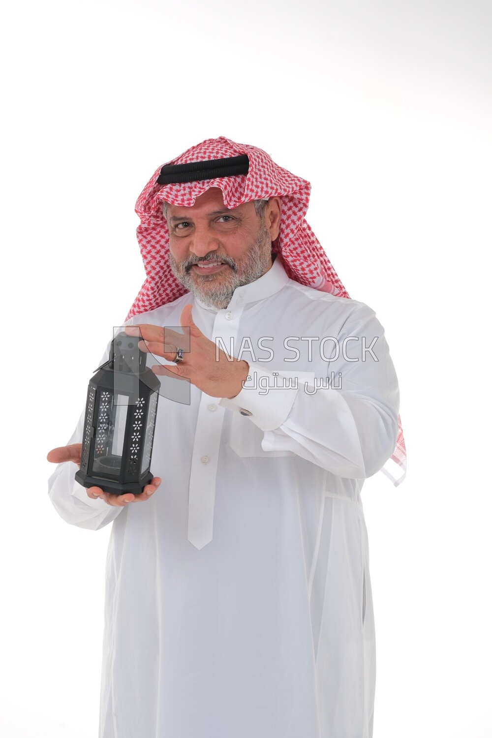 Saudi man holding a Ramadan lantern, Ramadan lantern, the blessed month of Ramadan, lighting and decorations for the month of Ramadan, Ramadan atmosphere, religious occasions