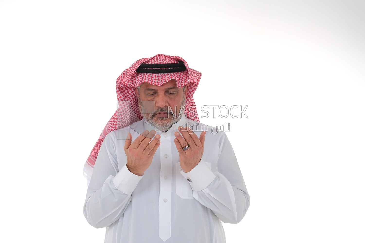Saudi man wearing a white dress, praying to god, praying on the prayer rug, Islam and worship, white background, Saudi model