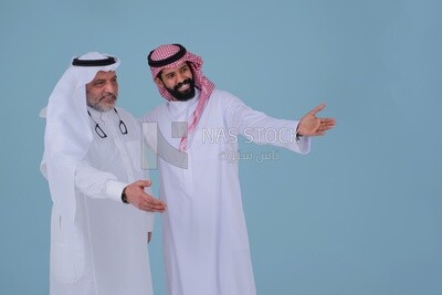 two Saudi men pointing at something, identifying a target, pointing towards something, finger movement and gestures