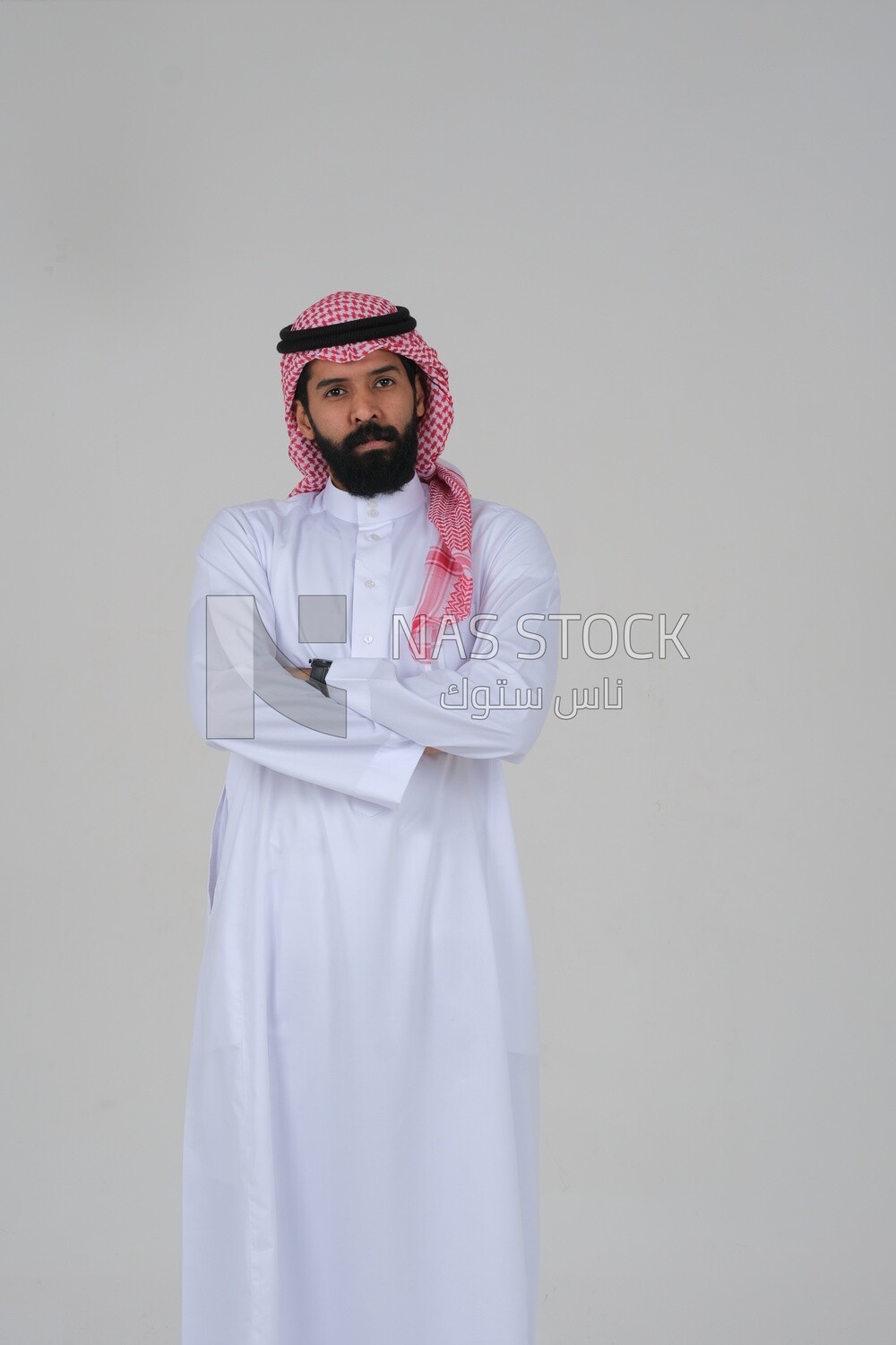 close-up of a Saudi man in traditional Saudi dress, Saudi model, white background