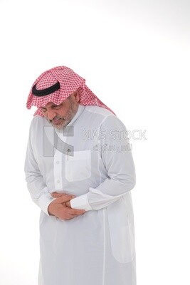 Saudi man placing his hands on his stomach,  abdominal and stomach pain, intestinal disorders, digestive system imbalance, white background