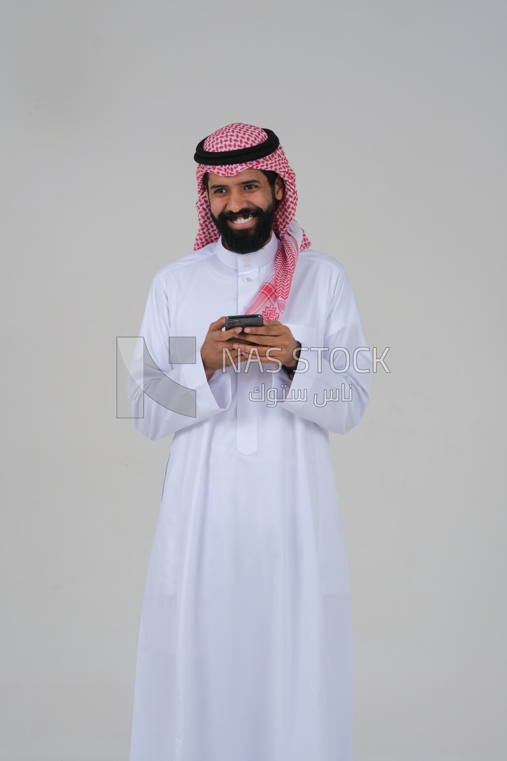 saudi man using a mobile phone, communicating with individuals, online requests and marketing, social relations, using technical devices, white background