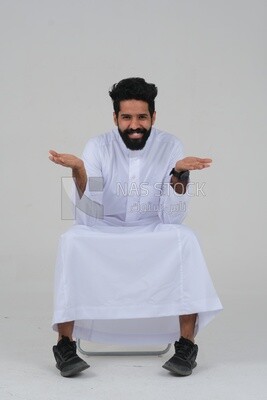 close-up of a Saudi man in traditional Saudi dress, sitting on a chair, Saudi model, white background