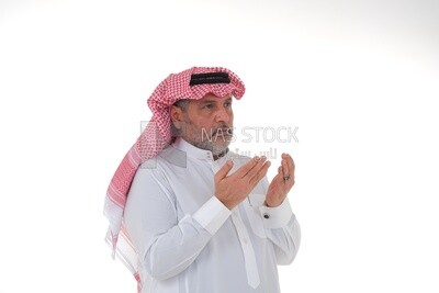 Saudi man wearing a white dress, praying to god, praying on the prayer rug, Islam and worship, white background, Saudi model