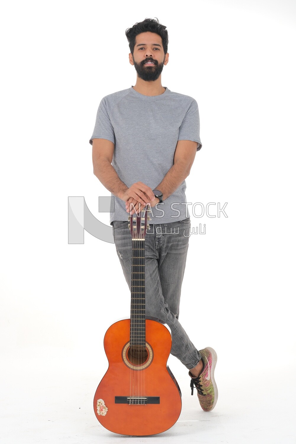 Saudi  man carrying a musical instrument, guitar playing talent, entertainment and singing, white background, Saudi model