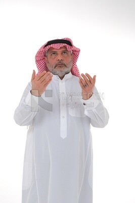 Saudi man wearing a white dress, praying to god, praying on the prayer rug, Islam and worship, white background, Saudi model