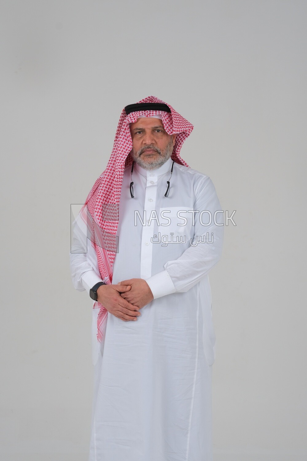 close-up of a Saudi man in traditional Saudi dress, wearing glasses, Saudi model, white background