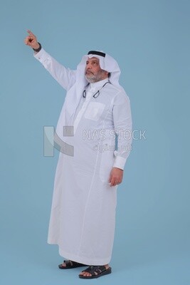 close-up of a Saudi man in traditional Saudi dress, pointing away, Saudi model, white background