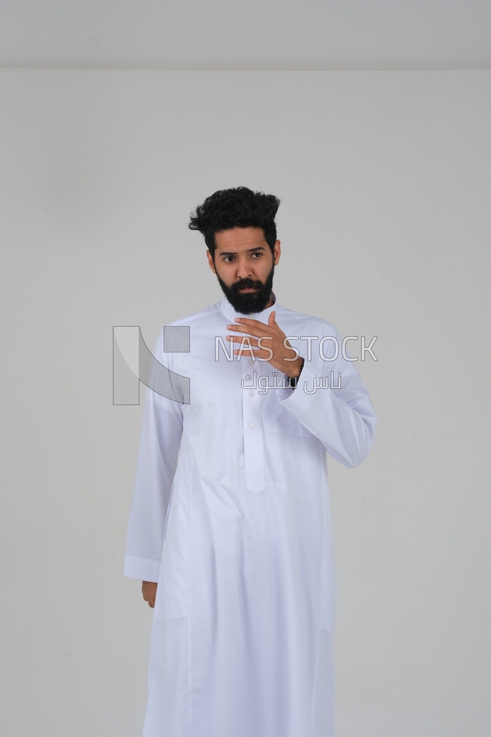 close-up of a Saudi man in traditional Saudi dress, Saudi model, white background