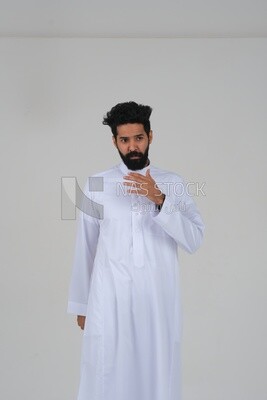 close-up of a Saudi man in traditional Saudi dress, Saudi model, white background