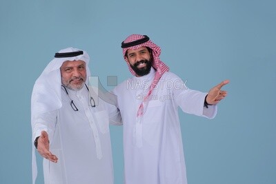 two Saudi men pointing at something, identifying a target, pointing towards something, finger movement and gestures