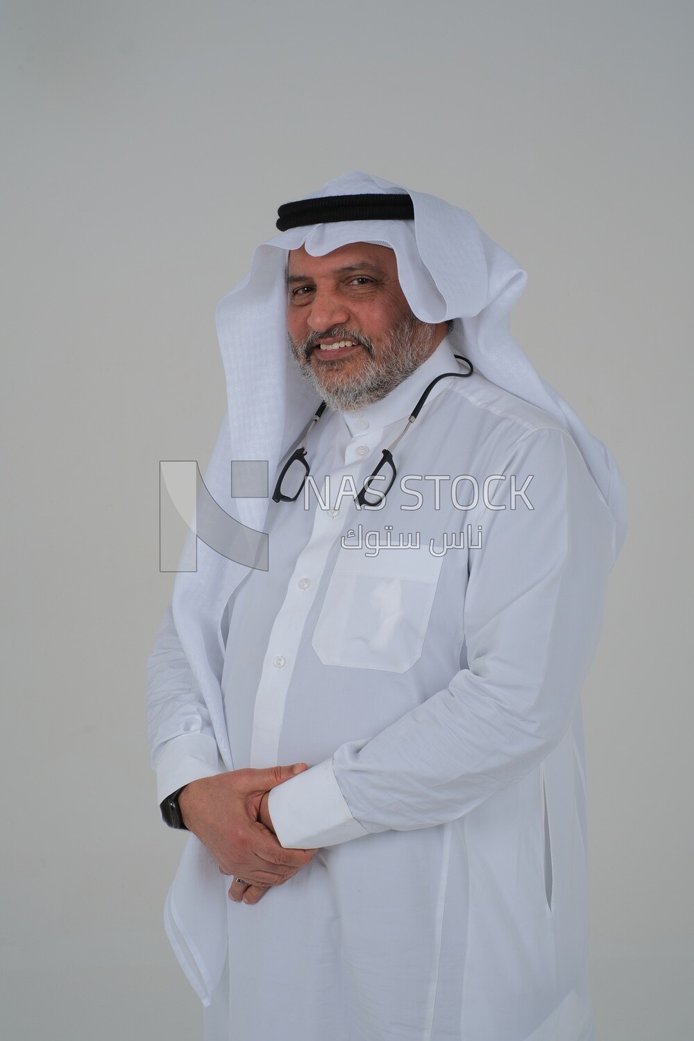 close-up of a Saudi man in traditional Saudi dress, Saudi model, white background